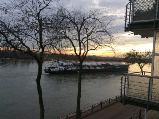 Cargo or cars floating on the Rhine.